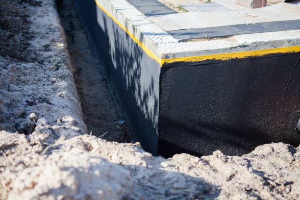Professional Basement Waterproofing technician working in Saint Marys City, MD
